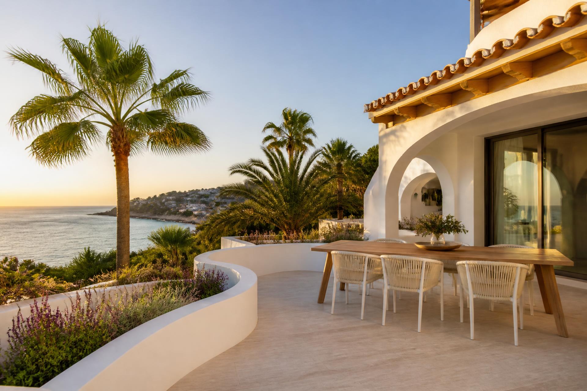 Sunlit Mediterranean villa terrace overlooking the sea on the Costa Blanca